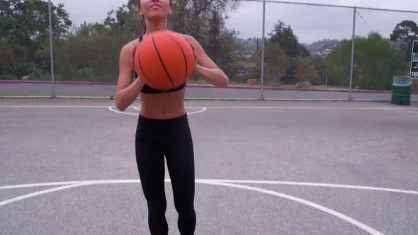 Athletic Woman playing basketball
