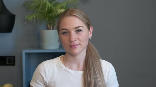 Happy Millennial Casual Professional Lady with White Teeth Pretty Face Posing for Close Up Portrait