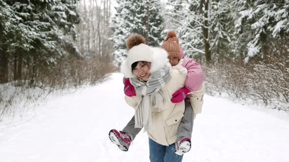Carrying Child on Back in Winter