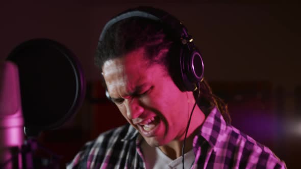 Male singer singing in a music studio