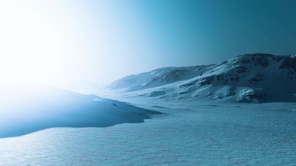 Snowed Mountains in Alaska with Fog