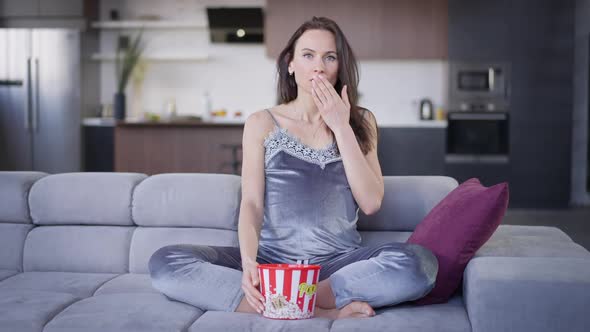 TV POV of Absorbed Young Beautiful Pregnant Woman Watching Interesting Movie Sitting on Couch with