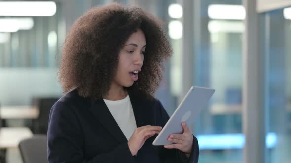 Portrait of Excited African Businesswoman Having Success on Tablet