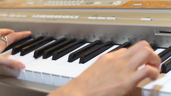 Musician Plays On An Electronic Piano