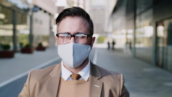 Portrait of Confident Businessman in Face Mask Outdoors