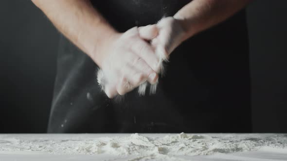 Man Brushing Flour of Hands