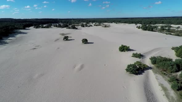 Jib down footage of sand dunes.