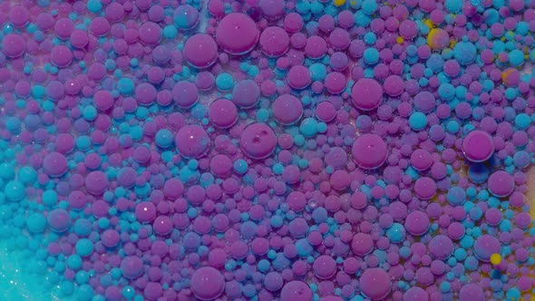 Ink Bubbles Mixed with Liquid Substance of Oil Milk Soap Bright Acrylic Paint on Colorful Surface