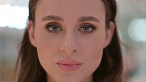 Close Up of Face of Young Woman Looking at Camera 