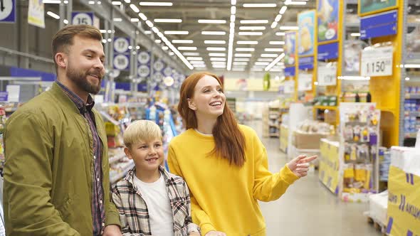 Happy Caucasian Family Enjoy Shopping with Child Boy