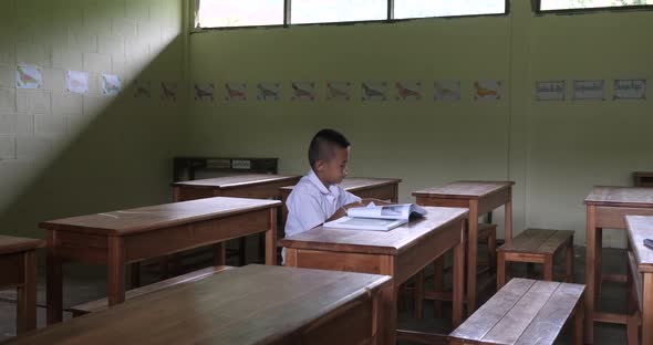 Boy Studying In Classroom