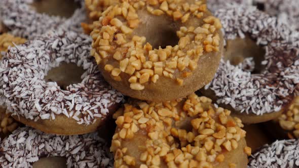 Vegan Donuts With Chocolate And Peanuts. Closeup. 