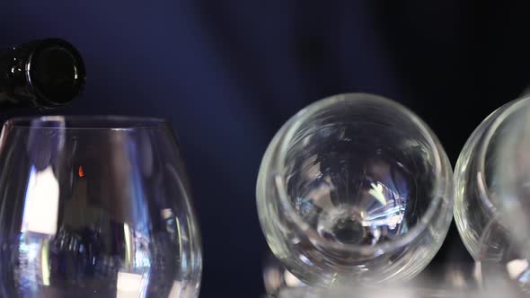 Wine. Closeup Of Red Wine Pouring Into Glass From Bottle