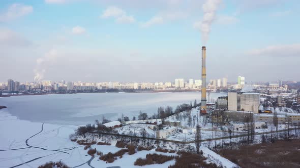 Waste Incinerator Plant with Smoking Smokestack at the Winter