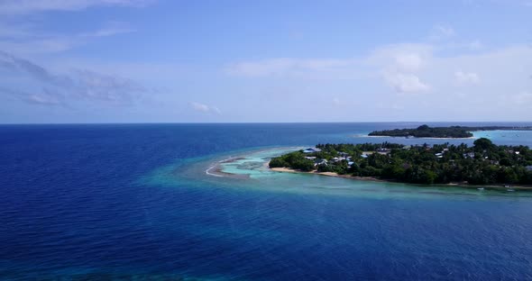 Beautiful above travel shot of a summer white paradise sand beach and blue water background 