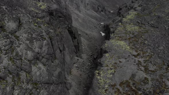 A Round View of Gray Stone Canyon with a Dry Riverbed Opening From a High Place