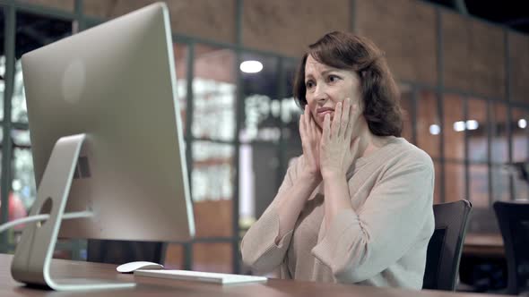 Creative Old Woman Reacting To Loss at Work