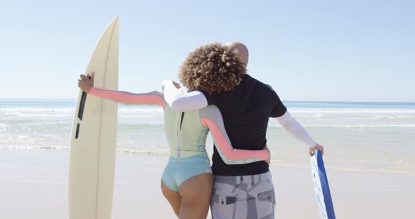 A Couple Embracing on Shore