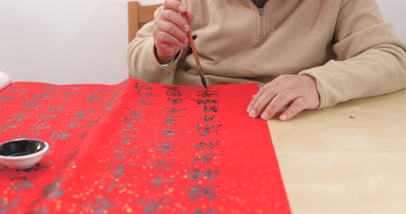 Writing chinese calligraphy with word meaning luck