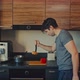 Seamless Loop.Man Clumsily trying to Cook Food. - VideoHive Item for Sale