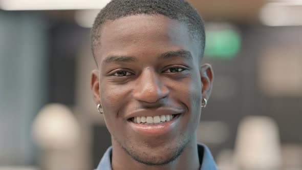 Face of Young African American Man Smiling at the Camera