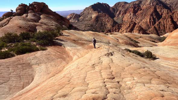 Woman hiking through Yant Flats in crazy desert terrain