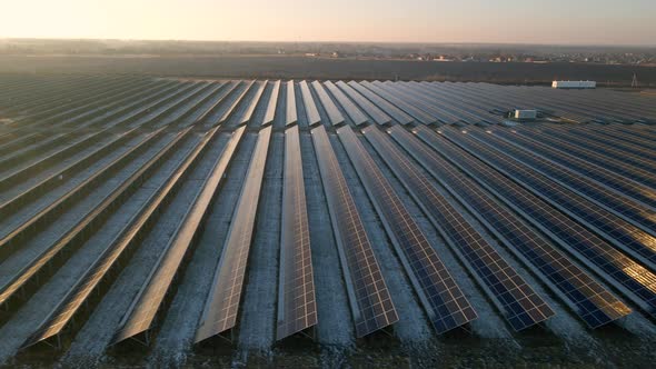 Aerial View of Solar Panels Stand in a Row in the Fields Power Ecology Innovation Nature Environment