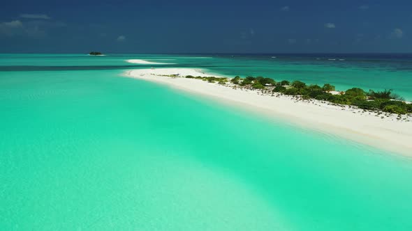 Aerial panorama of perfect tourist beach holiday by blue green water with white sandy background of 