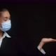 Business Woman in a Medical Mask Points with Her Palm to an Empty Copy Space - VideoHive Item for Sale