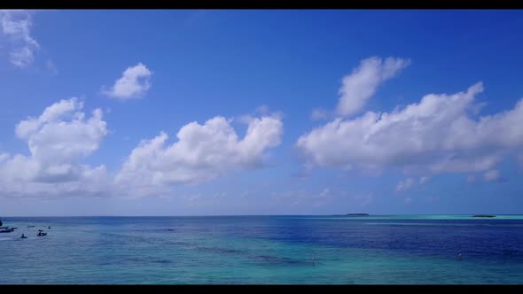 Aerial top down landscape of exotic seashore beach break by shallow ocean and white sandy background