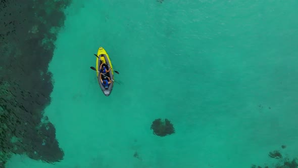 Aerial View of Yellow Kayak in Blue Lagoon at Summer