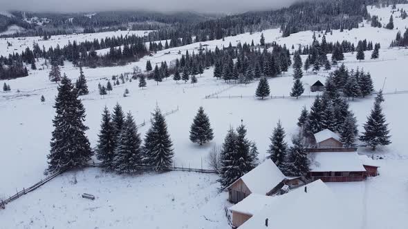 Aerial Over Traditional Mountain Village During Winter
