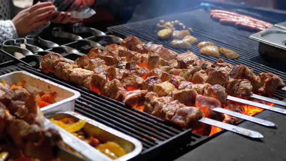 Shish Kebab Cooked on the Grill on the Street Market