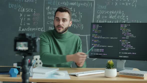 IT Teacher Recording Lesson with Digital Camera Explaining Software Coding in Classroom
