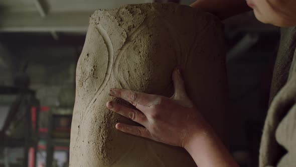 Woman Is Sculpting From Raw Clay