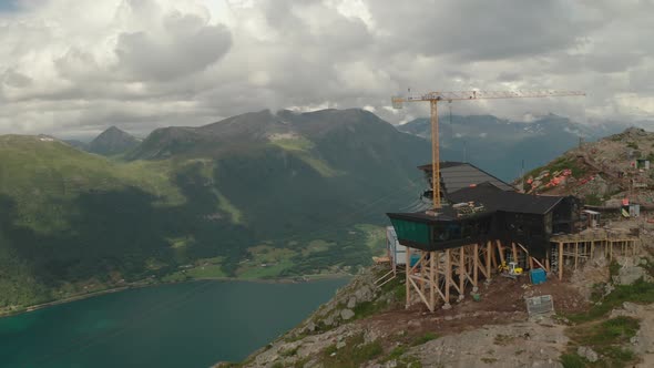 Exterior View Of Eggen Restaurant And Romsdalsgondolen With Crane In Andalsnes, Norway. - aerial orb