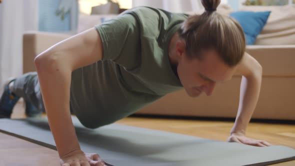 Handsome Young Man Doing Daily Push Up Exercise at Home.