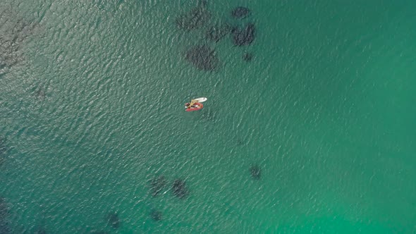 Aerial view of small boats on turquoise Mediterranean sea, Greece