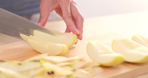 Cutting apple into small pieces