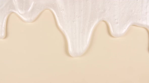 White Cosmetic Gel Fluid Cream With Molecule Bubbles Flowing On The Plain Beige Surface