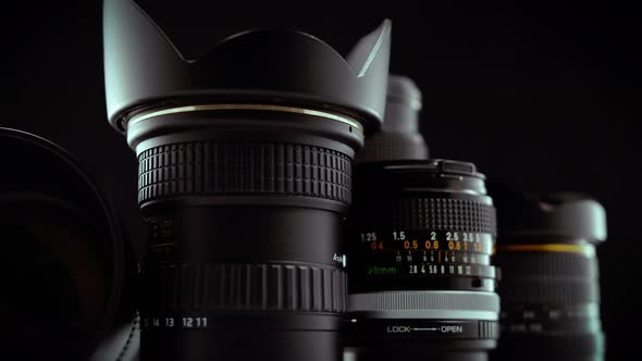 Macro Cinematic Reveal Of Camera Lenses On Black Background