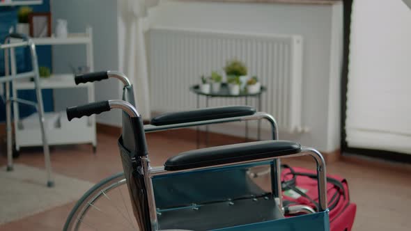 Close Up of Wheelchair in Empty Room at Nursing Home