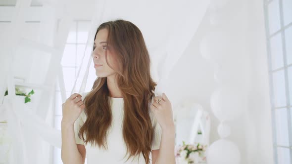 Young Beautiful Girl in White Decor