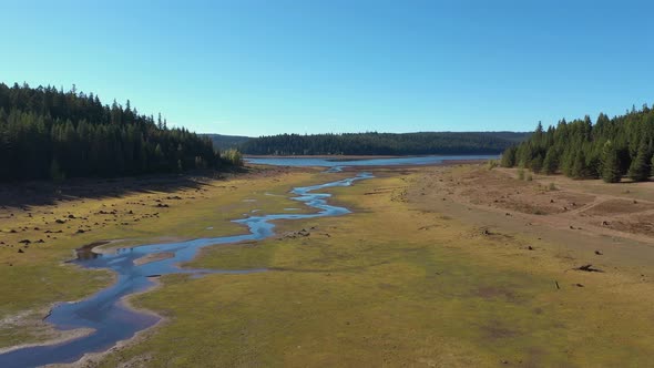 Aerial flying above dry lake on a hot summer day in Oregon.