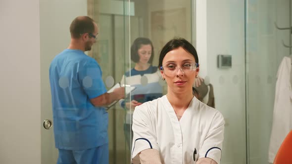 Pediatric Dentist Looking at Camera Smiling