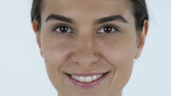 Winking Eye, Girl Face, White Background in Studio