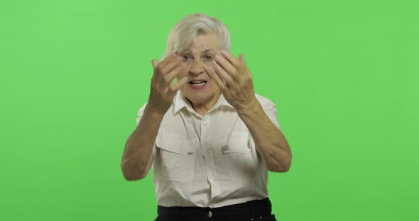 An Elderly Woman Shout and Waving with Hands. Old Grandmother Smiles. Chroma Key