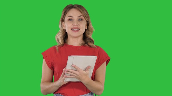 Presenter Woman in Red T-Shirt Holding a Tablet Turning