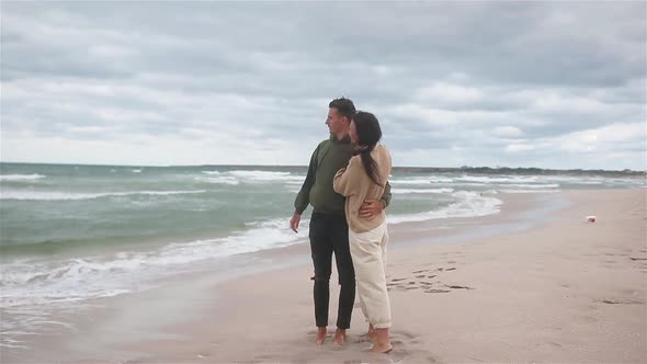 Young Couple on White Beach During Summer Vacation