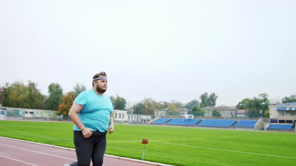 Charismatic Obese Man Running Fast To Loose the